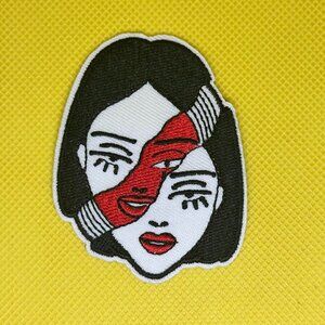 Two-Faced Grace Black and red embroidered iron on patch